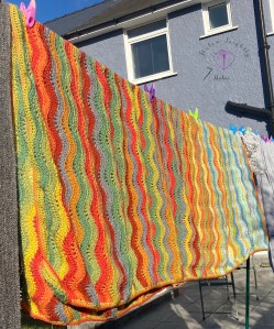 Woodland Ripple blanket finally finished, washed and drying ready for delivery š